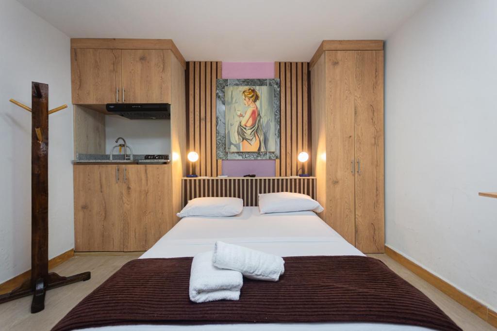 Postel nebo postele na pokoji v ubytování Hotel Lares 70 Laureles