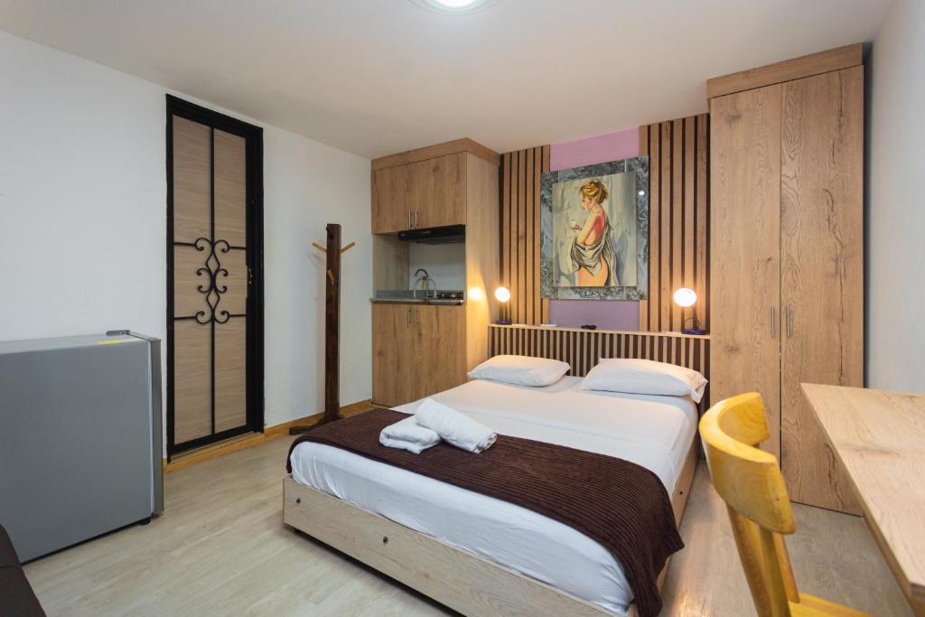 Postel nebo postele na pokoji v ubytování Hotel Lares 70 Laureles