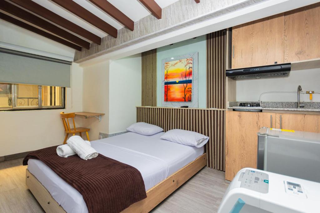 Postel nebo postele na pokoji v ubytování Hotel Lares 70 Laureles