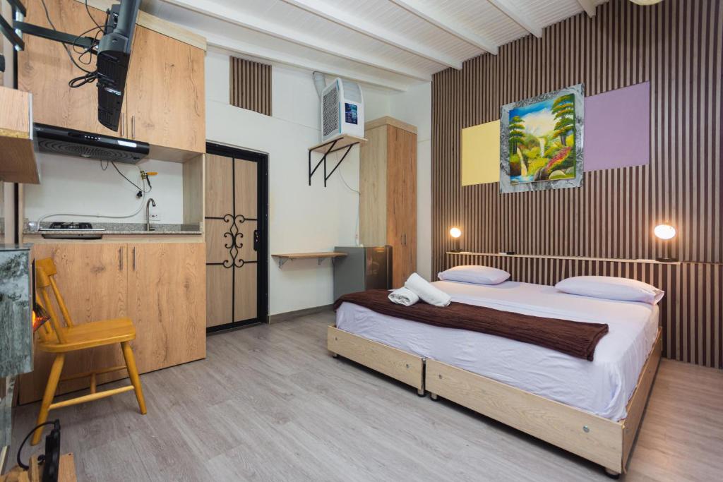 Postel nebo postele na pokoji v ubytování Hotel Lares 70 Laureles