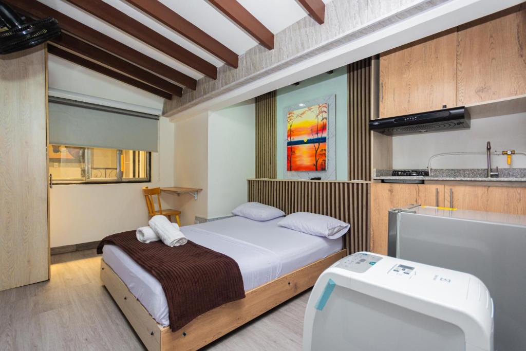 Postel nebo postele na pokoji v ubytování Hotel Lares 70 Laureles