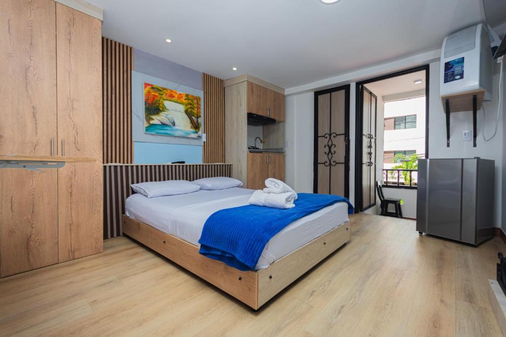Postel nebo postele na pokoji v ubytování Hotel Lares 70 Laureles