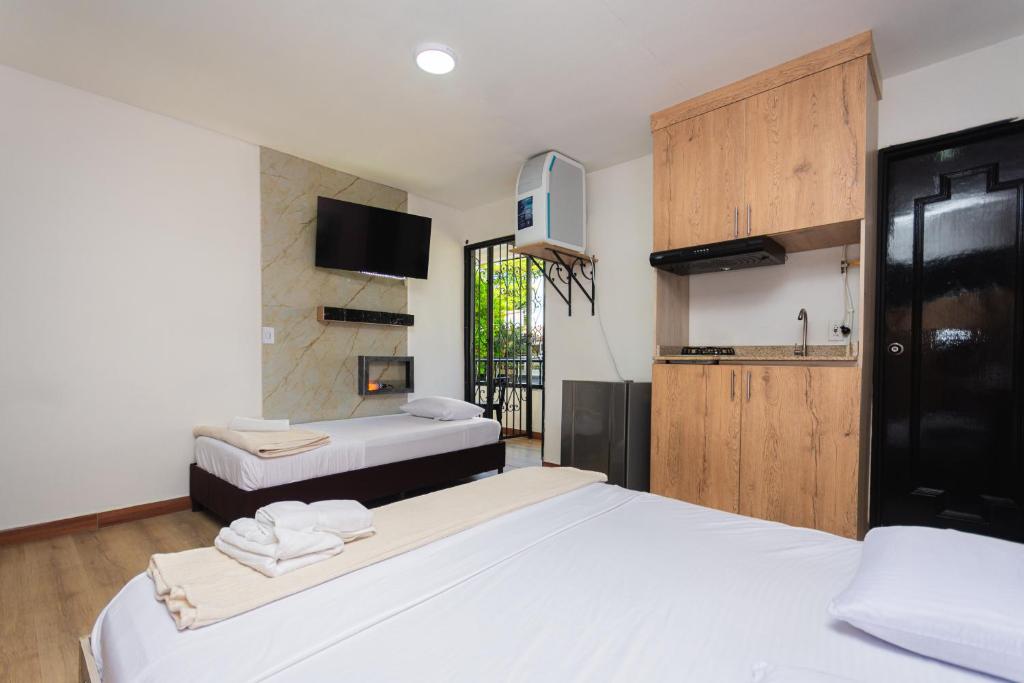 Postel nebo postele na pokoji v ubytování Hotel Lares 70 Laureles