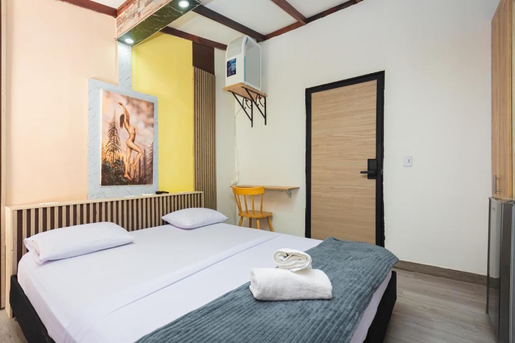 Postel nebo postele na pokoji v ubytování Hotel Lares 70 Laureles