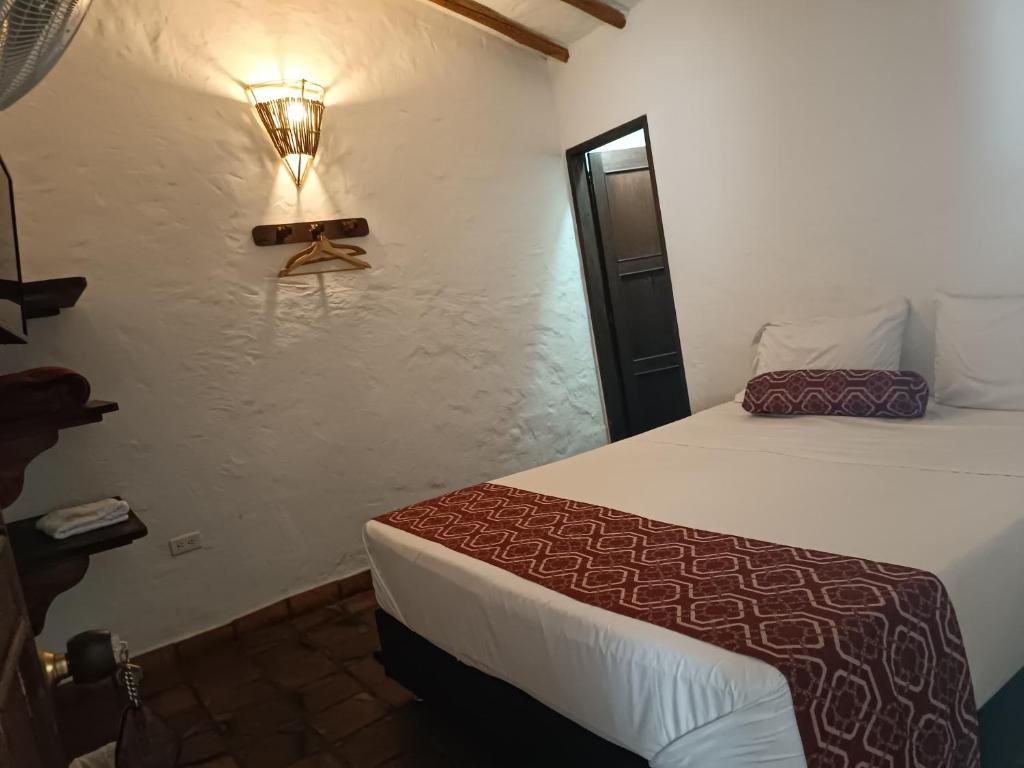 Postel nebo postele na pokoji v ubytování MONCOGUA Casa de Hospedaje