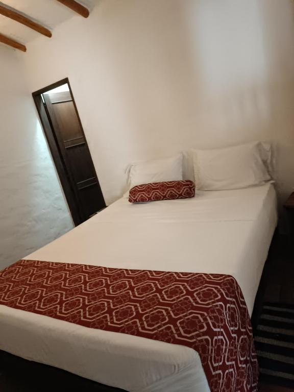 Postel nebo postele na pokoji v ubytování MONCOGUA Casa de Hospedaje