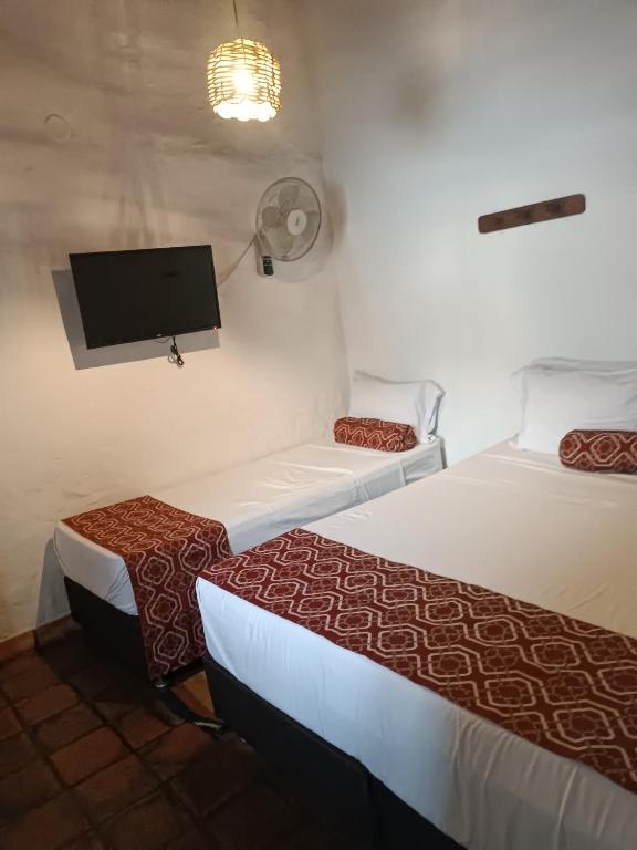 Postel nebo postele na pokoji v ubytování MONCOGUA Casa de Hospedaje