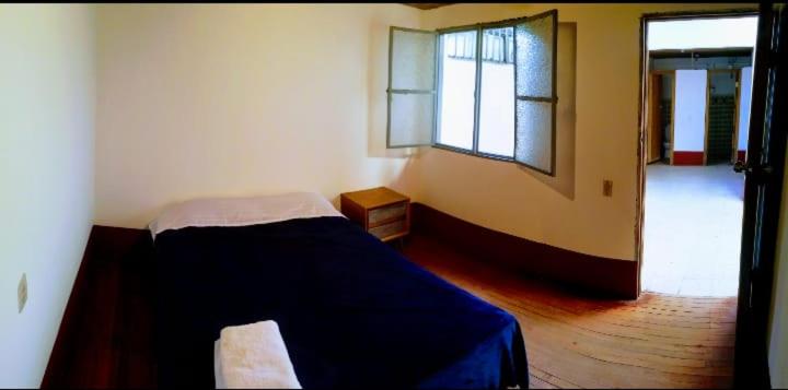 Ένα ή περισσότερα κρεβάτια σε δωμάτιο στο Hostal Juan Páramo