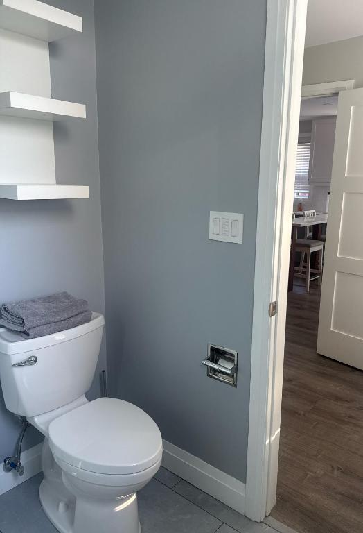 a bathroom with a white toilet in a room at 925 Rentals in Hamilton