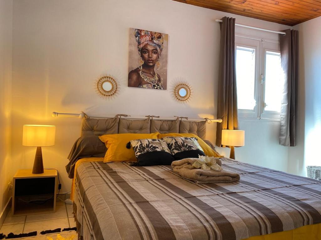 Ένα ή περισσότερα κρεβάτια σε δωμάτιο στο Les Alizés 3 chambres et piscine Les Anses d Arlet