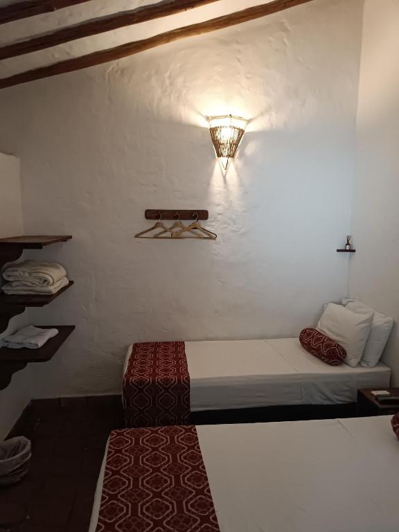 Postel nebo postele na pokoji v ubytování MONCOGUA Casa de Hospedaje