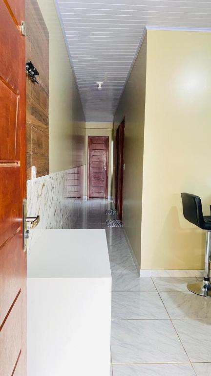 an empty hallway with a door in a room at Kitnet_Familiar 2/4 in Boa Vista