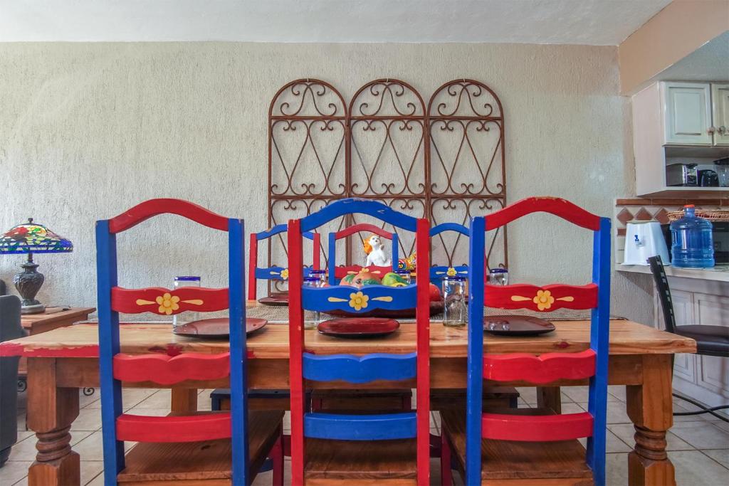 a dining room table with four chairs and a table with a table at Princesa De Penasco in Punta Penasco New