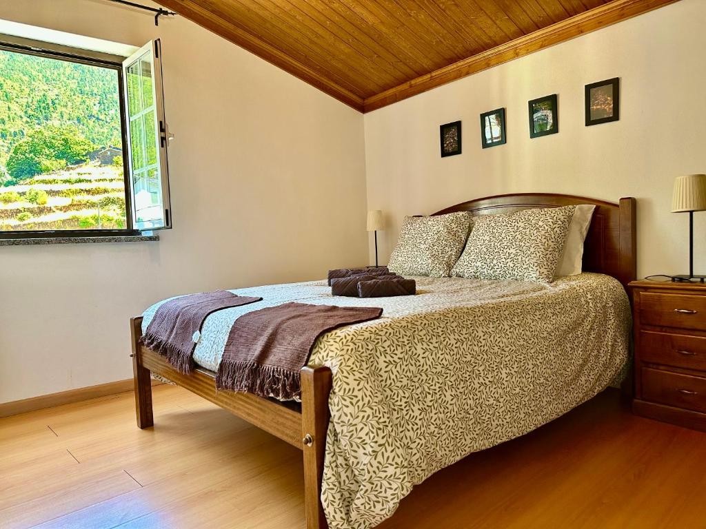 En eller flere senge i et værelse på Égua Nature House