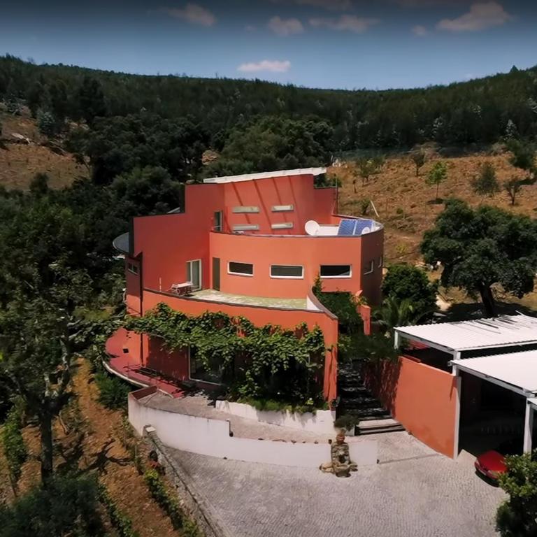 an aerial view of a house on a hill at Quinta dos Sarilhos in Pedrógão Grande
