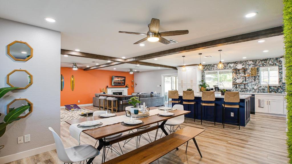 a dining room and kitchen with a table and chairs at Laurel Gilbert in Gilbert