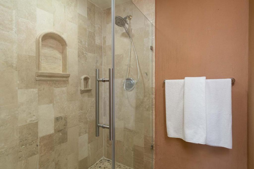a bathroom with a shower with a white towel at Princesa De Penasco in Punta Penasco New