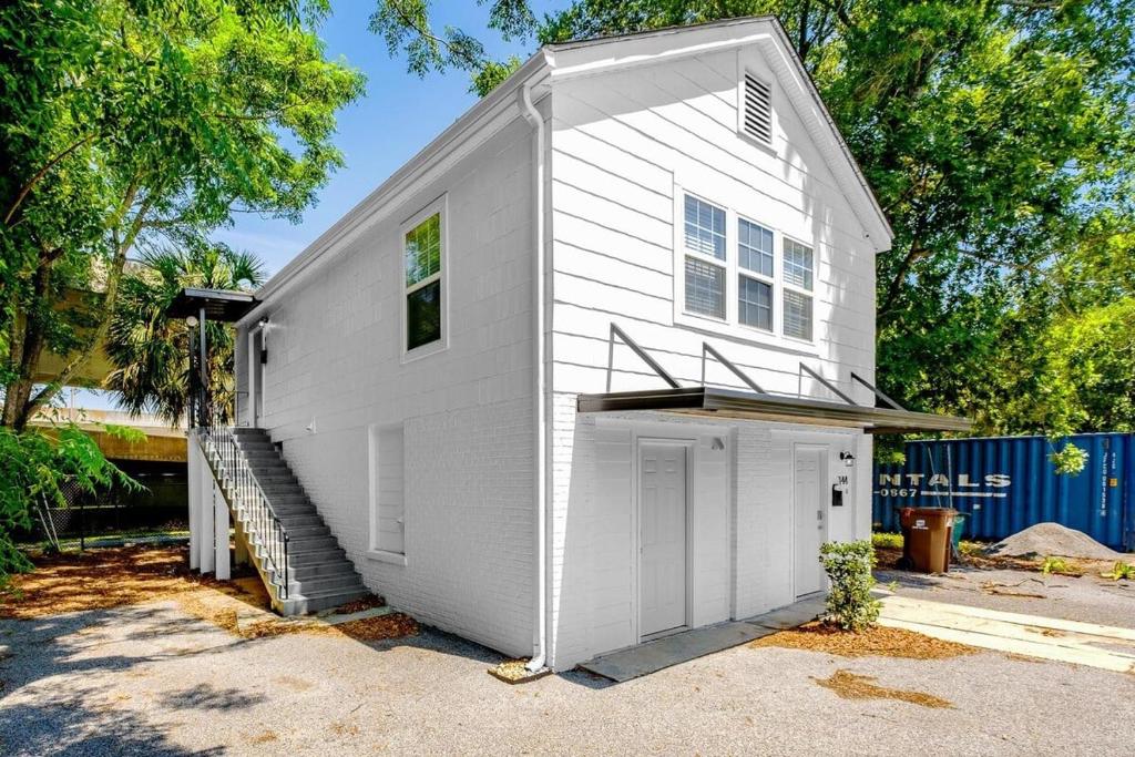 a white house with a garage in a driveway at Hopkins 144 in Biloxi