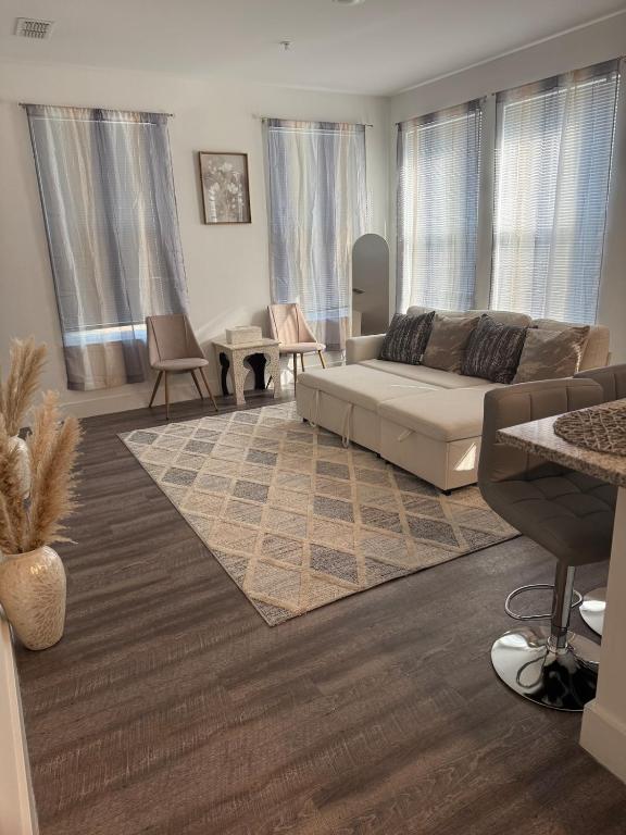 a living room with a couch and a table at Cozy Contemporary Condo in Atlanta