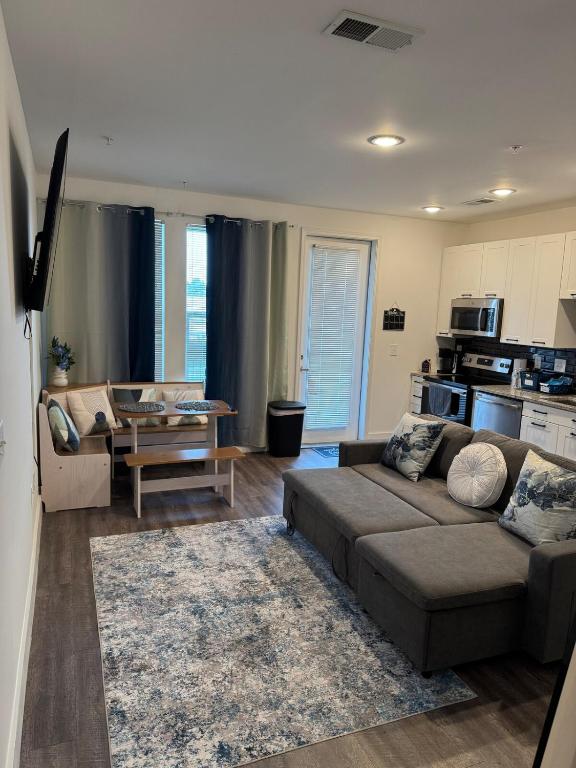 a living room with a couch and a table at Peaceful Pad on Peters in Atlanta