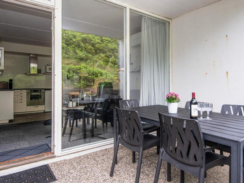 a dining room with a table and chairs at 4 person holiday home in Ringkøbing in Ringkøbing