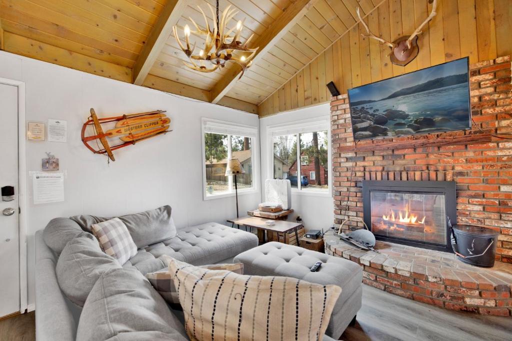 a living room with a couch and a fireplace at Storyville #2294 in Big Bear Lake