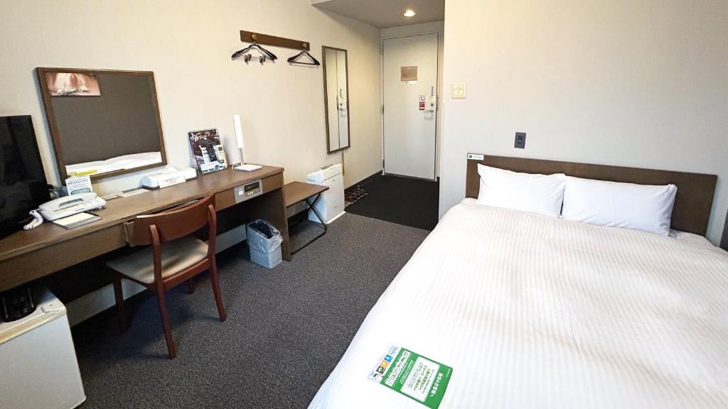 Postel nebo postele na pokoji v ubytování Hotel Route-Inn Myoko Arai