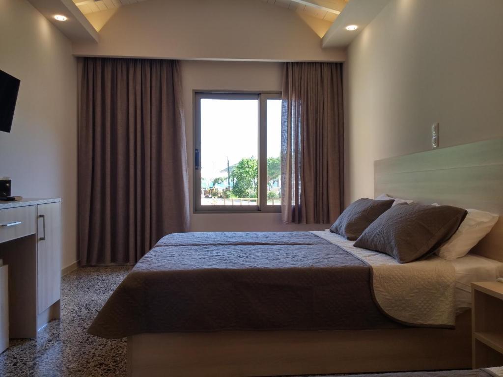 Ein Bett oder Betten in einem Zimmer der Unterkunft Anetis Hotel