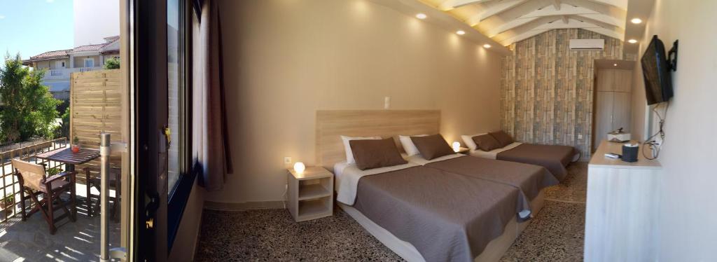 Ein Bett oder Betten in einem Zimmer der Unterkunft Anetis Hotel