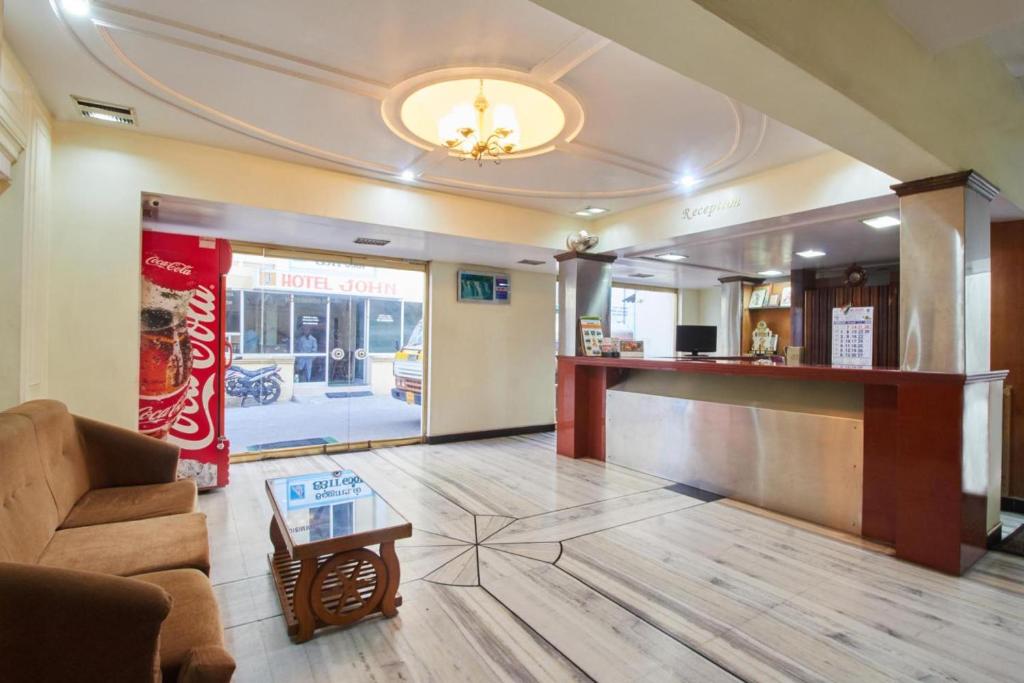 a lobby of a fast food restaurant with a bar at Hotel Sun Rock in Kanyakumari