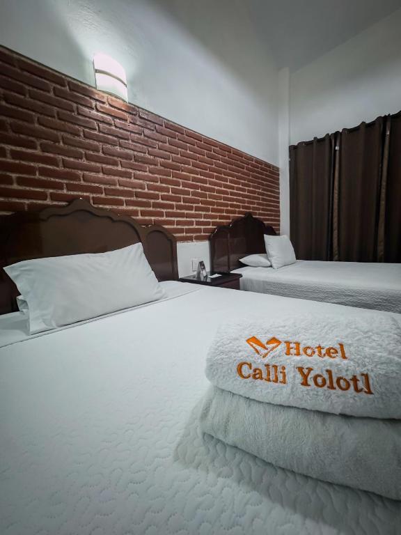 Katil atau katil-katil dalam bilik di Hotel CALLI YOLOTL Teotihuacan