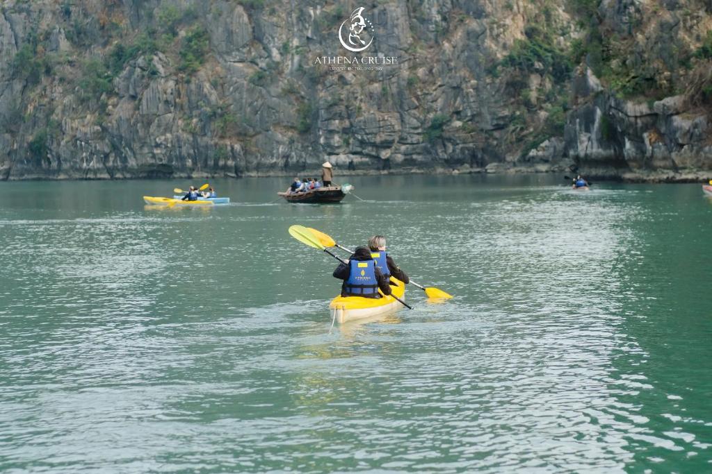 a group of people in kayaks on a lake at Halong Athena Cruise in Ha Long