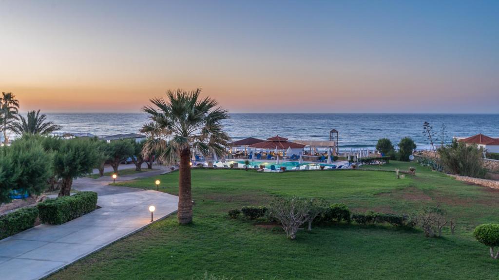 a view of the ocean from a resort at Windmill Apartments in Malia