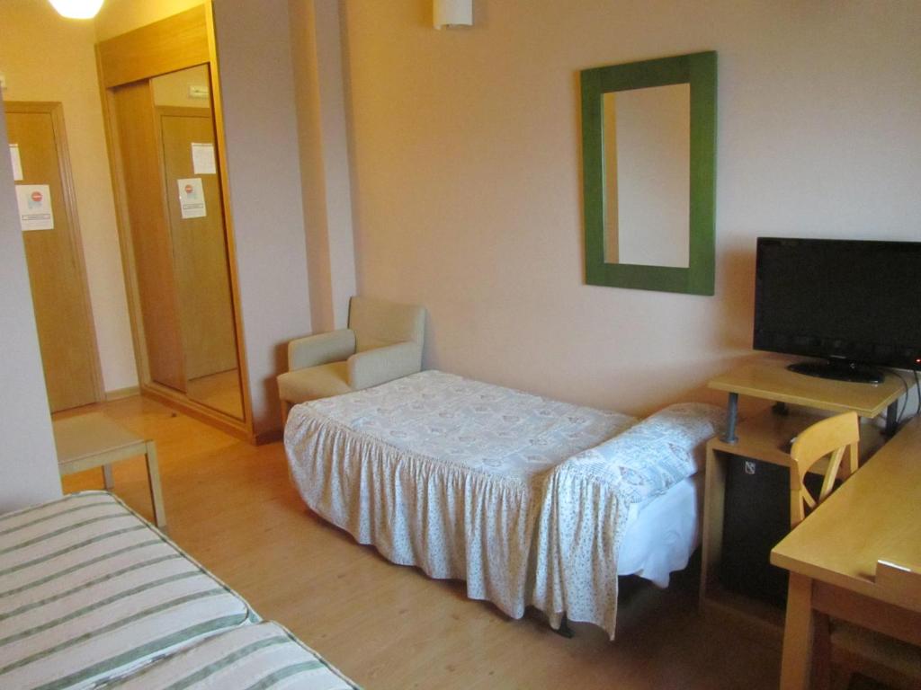 Postel nebo postele na pokoji v ubytování Hotel Galayos