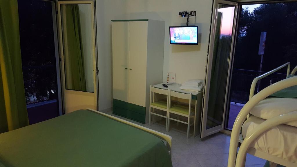 Postel nebo postele na pokoji v ubytování Hotel Ulisse