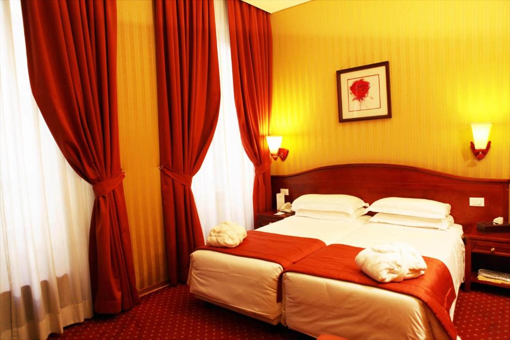 Postel nebo postele na pokoji v ubytování Augusta Lucilla Palace