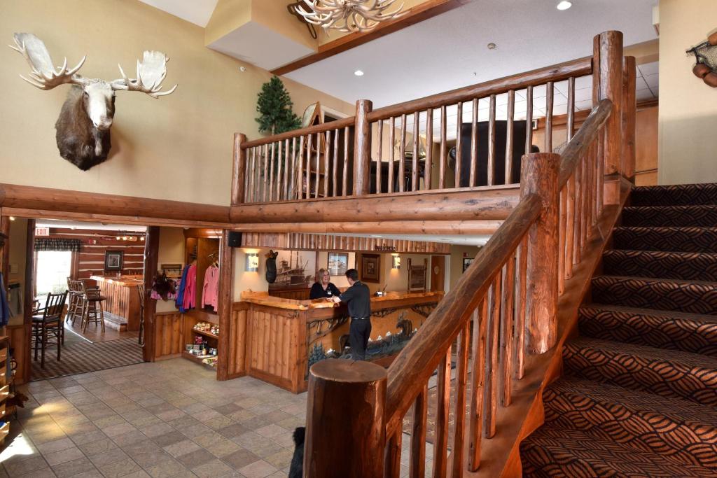 a man is standing at a counter in a restaurant at Stoney Creek Inn Quincy in Quincy