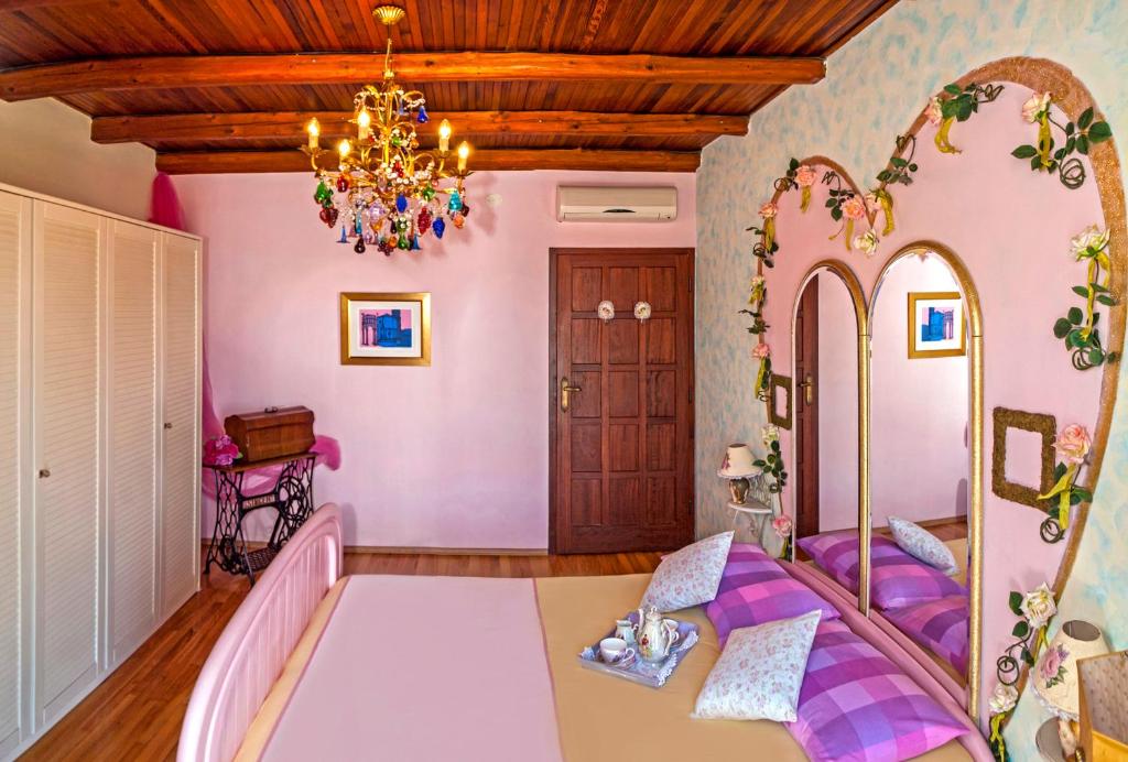 Postel nebo postele na pokoji v ubytování Villa Ria