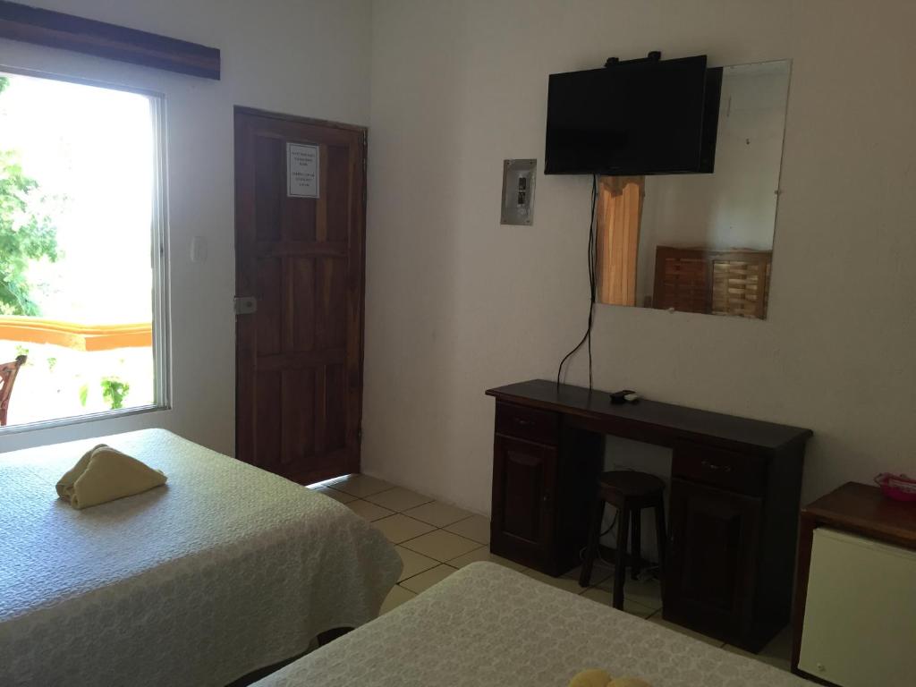 TV a/nebo společenská místnost v ubytování Hotel Coco Beach