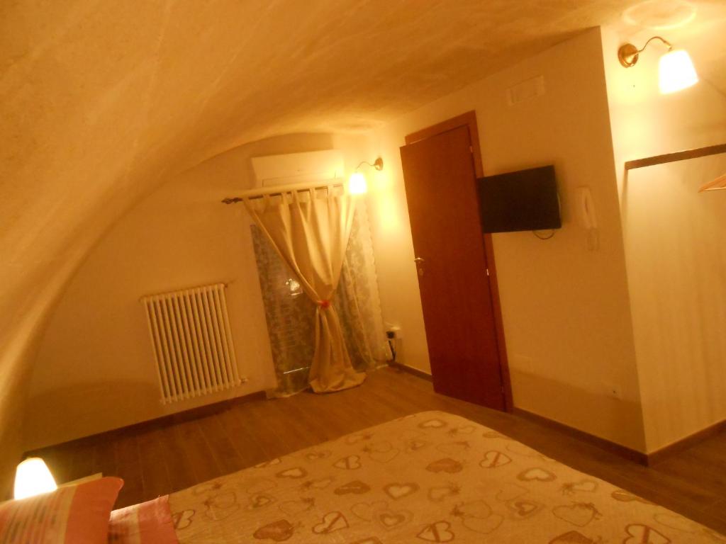 Postel nebo postele na pokoji v ubytování Le due arcate