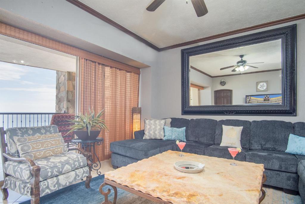 a living room with a couch and a table at Scenic & Spacious Adorable Ocean Front Condo in Puerto Peñasco