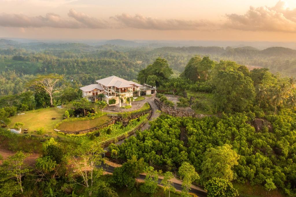 an aerial view of a house in the middle of a forest at Ligness Green Odyssey in Wanduramba