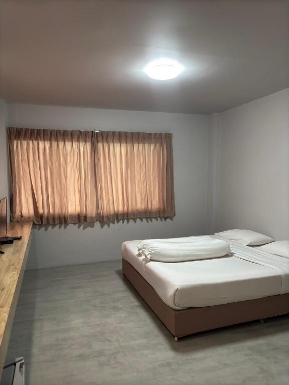 Postel nebo postele na pokoji v ubytování Lithai Guesthouse