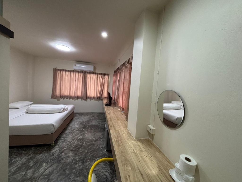 Postel nebo postele na pokoji v ubytování Lithai Guesthouse