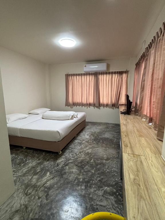 Postel nebo postele na pokoji v ubytování Lithai Guesthouse