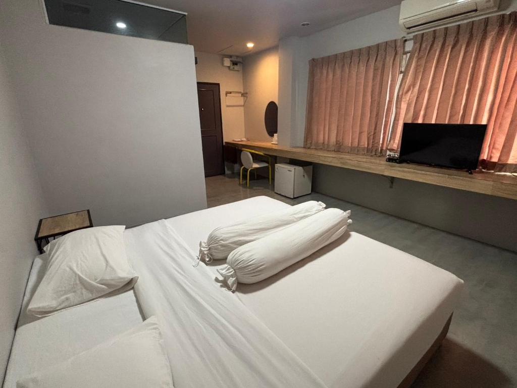 Postel nebo postele na pokoji v ubytování Lithai Guesthouse