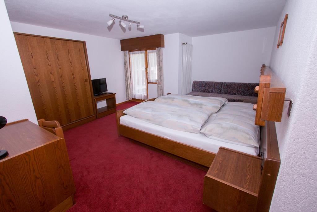 Postel nebo postele na pokoji v ubytování Monte Rosa