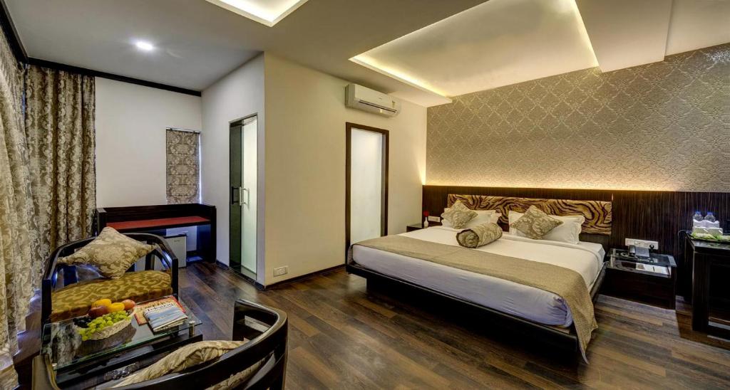 Postel nebo postele na pokoji v ubytování Viceroy Boutique Hotel
