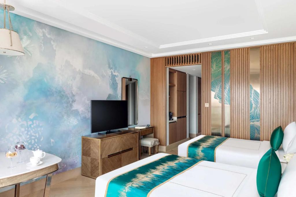 Postel nebo postele na pokoji v ubytování hotel julee