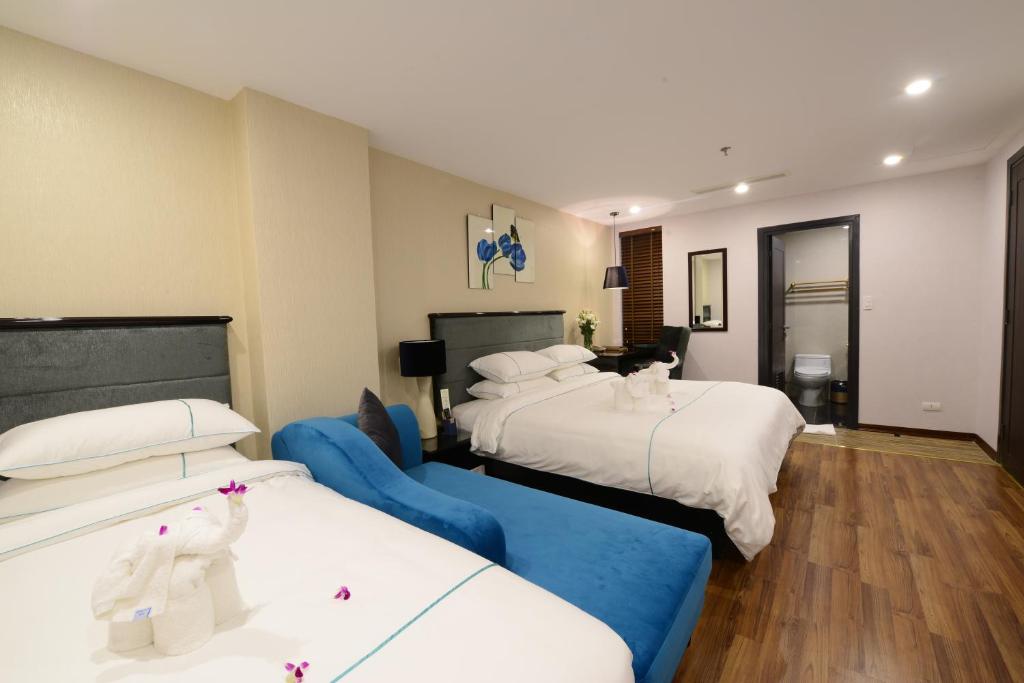 Postel nebo postele na pokoji v ubytování Hanoi Emerald Waters Hotel & Spa